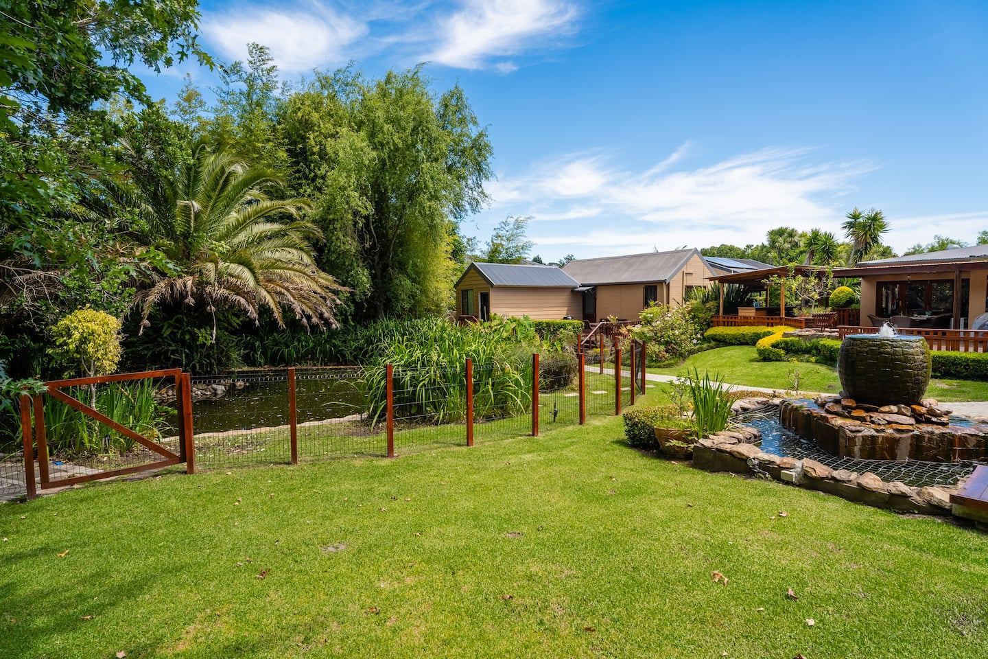 The gardens, koi pond and cottages at 13 on Moodie